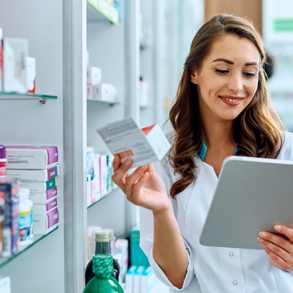 Pharmacist using digital for pharma packaging